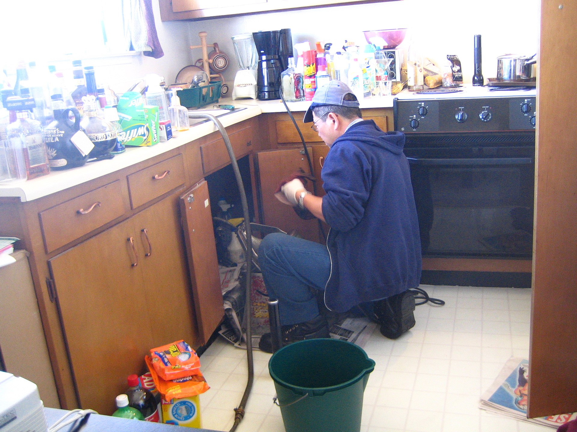 Plumber working on pipes